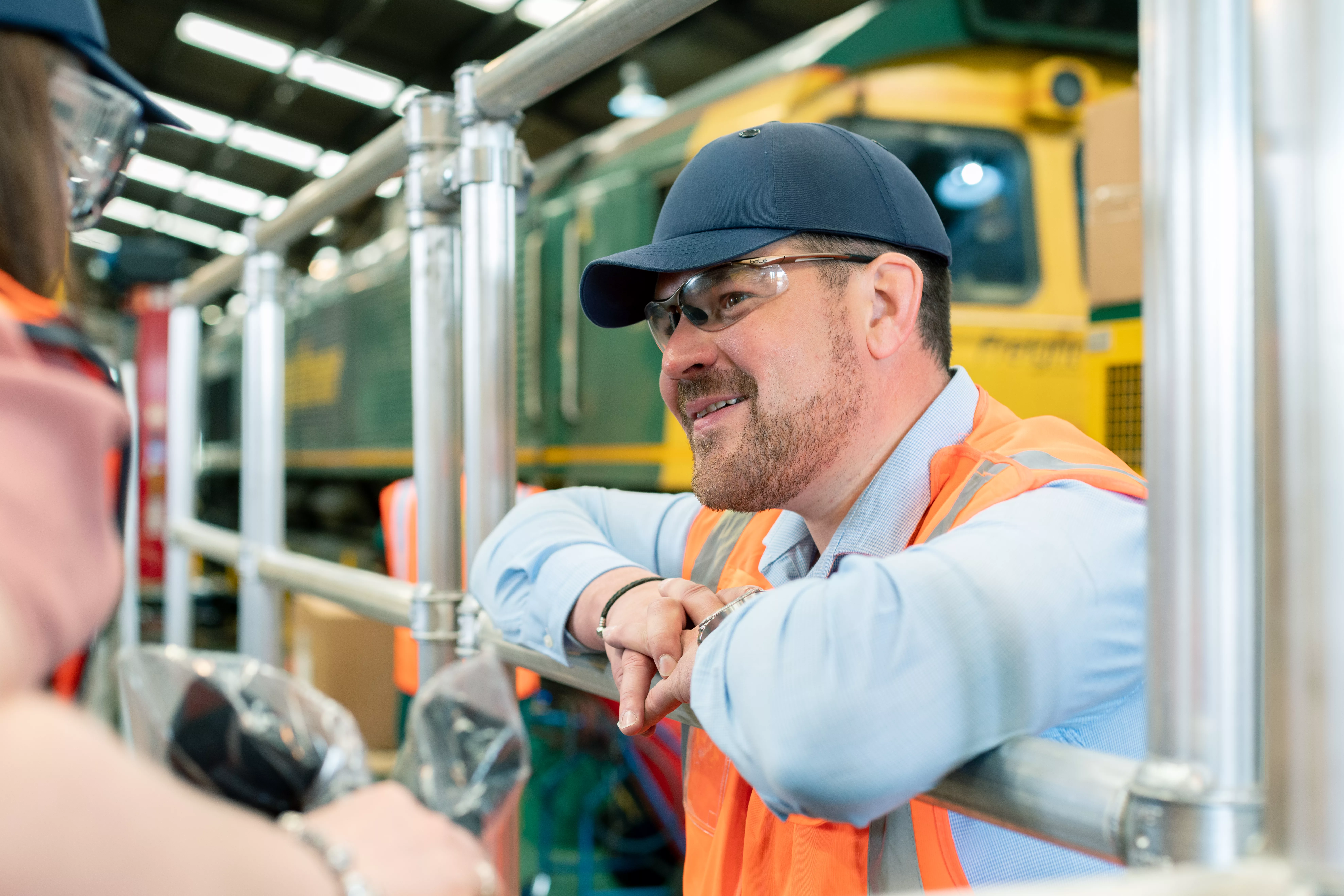 Freightliner employee working in vehicle maintenance facility.
