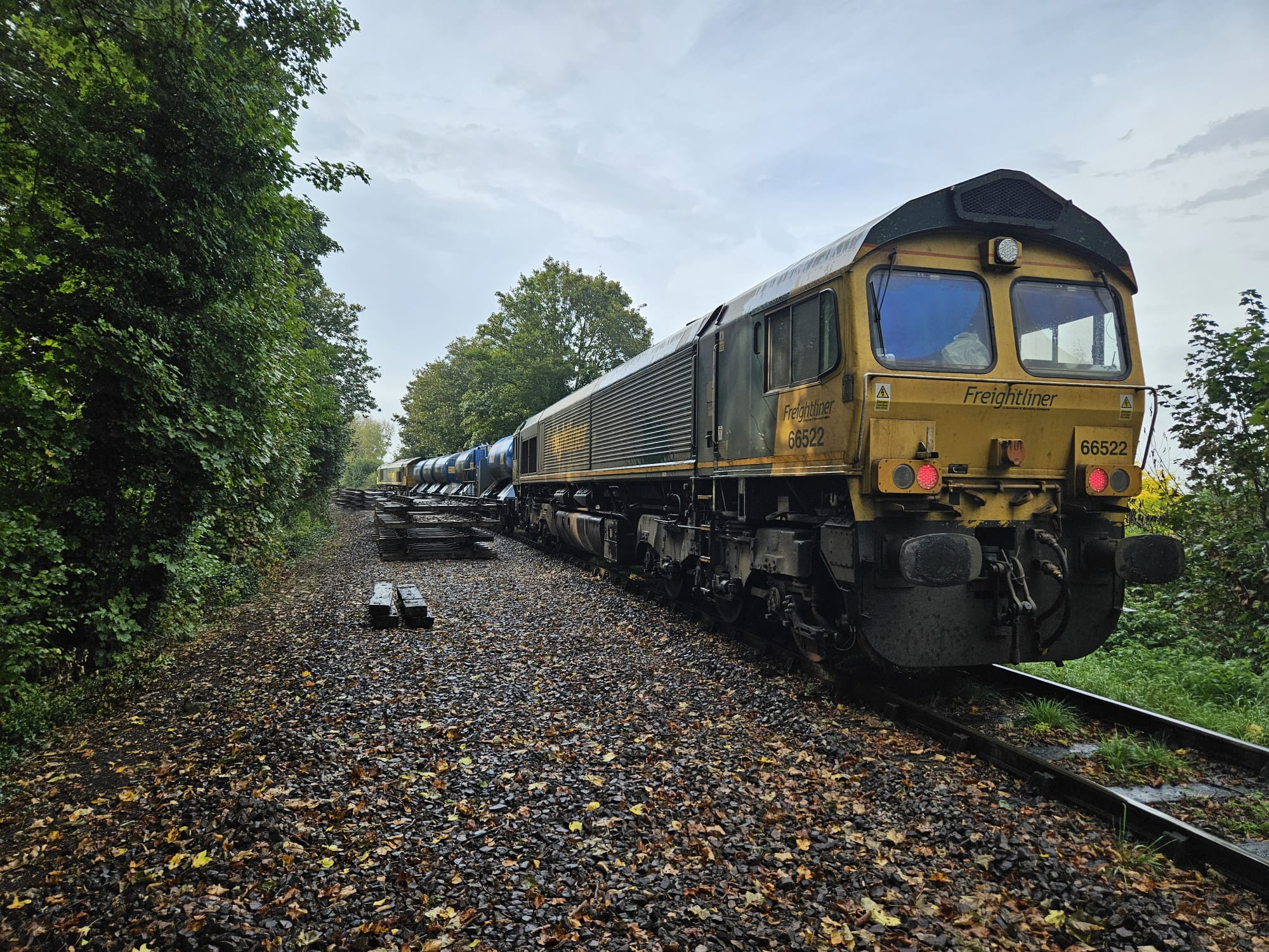 Freightliner rail head treatment train working on the tracks.